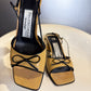 Vintage 90s Balenciaga Paris two tone beige and black square toe bow sandals close-up.