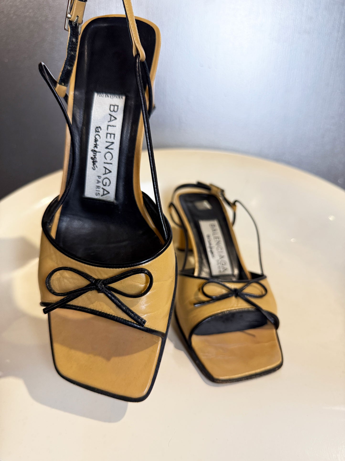 Vintage 90s Balenciaga Paris two tone beige and black square toe bow sandals close-up.