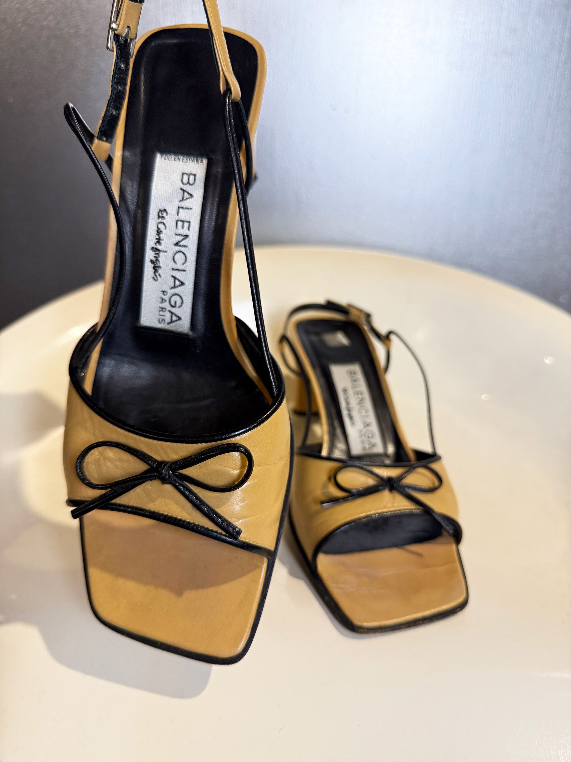 Vintage 90s Balenciaga Paris two tone beige and black square toe bow sandals close-up.
