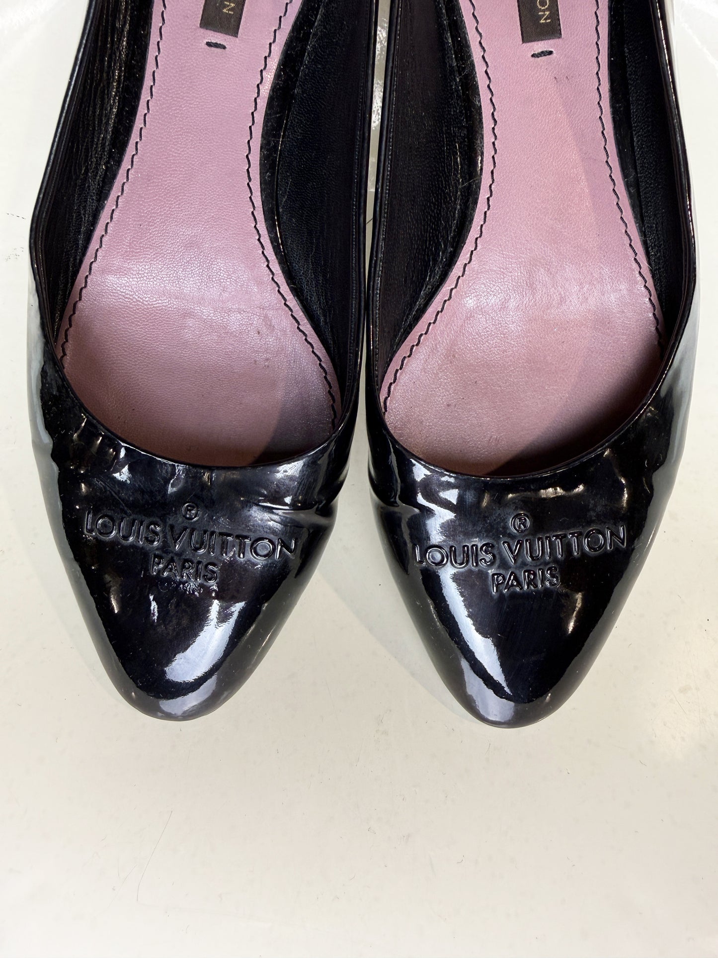 Top view showing pink leather lining of vintage Louis Vuitton ballet flats.