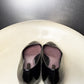 Back view of vintage Louis Vuitton black patent leather ballet flats.